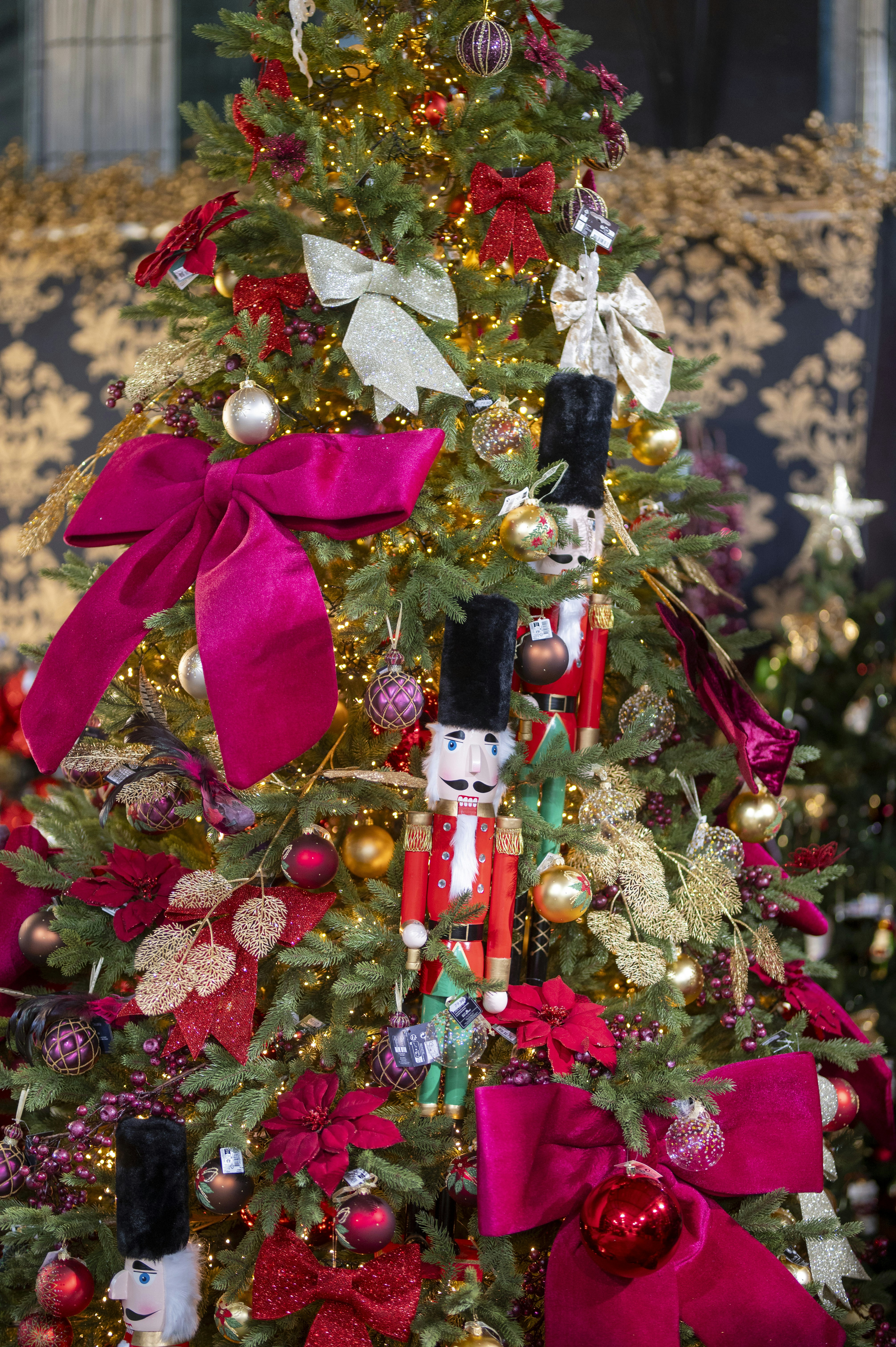A decorated christmas tree with nutcracker ornaments.