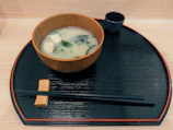 Bowl of miso soup with tofu and seaweed