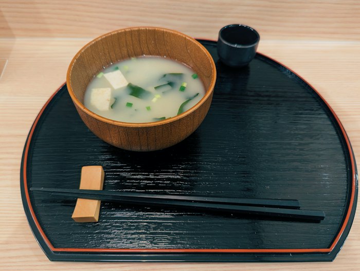 Umami mushroom broth in a wooden bowl