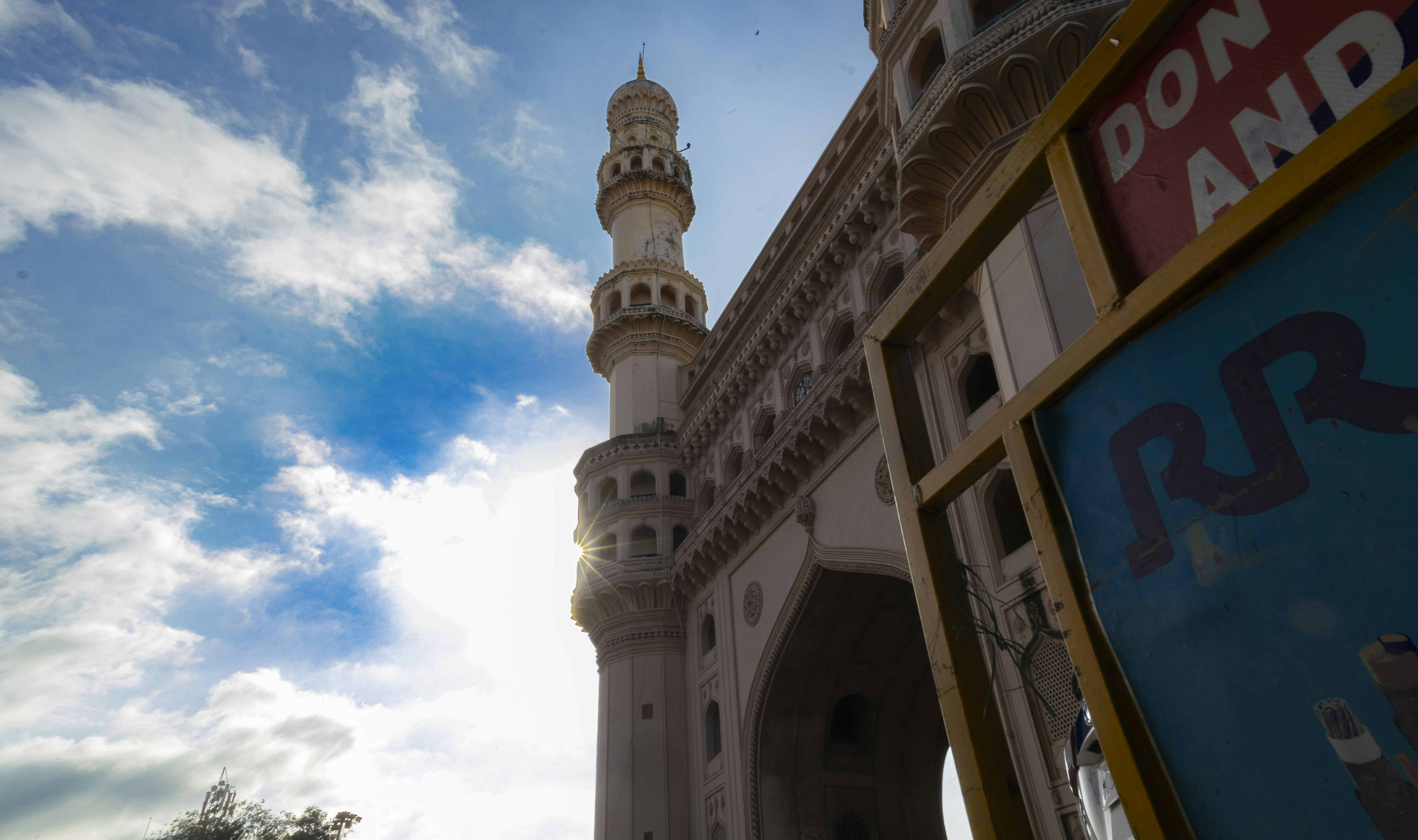 Charminar monument against a bright sky