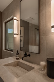 Modern bathroom sink with a large mirror above
