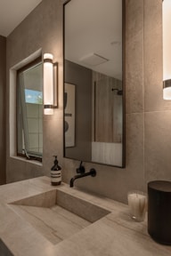 Modern bathroom sink with a large mirror above