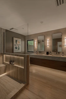 Modern bathroom with double vanity and shower area