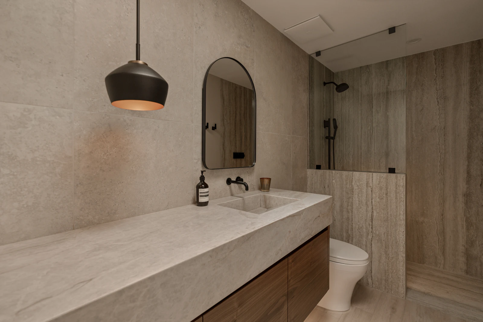 Stone bathroom vanity with pendant light