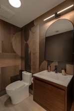 Modern bathroom with patterned wood accent wall