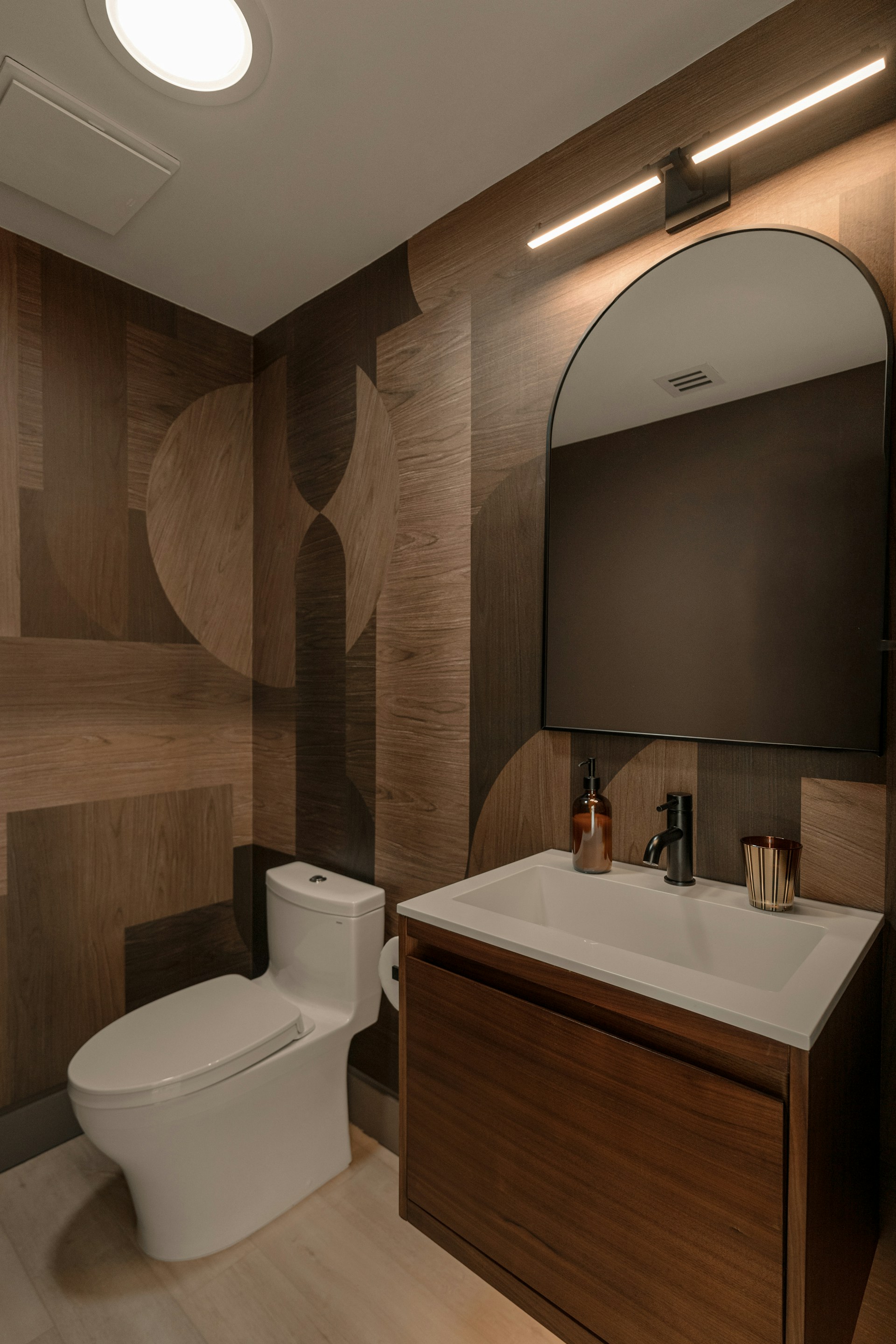Modern bathroom with patterned wood accent wall