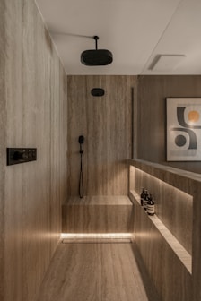 Modern bathroom with marble shower and ambient lighting