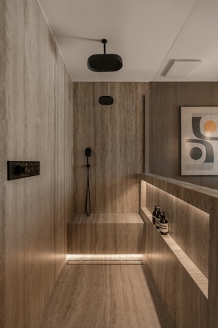 Modern bathroom with marble shower and ambient lighting
