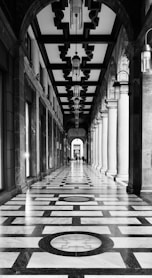 Ornate arched walkway with patterned marble floor
