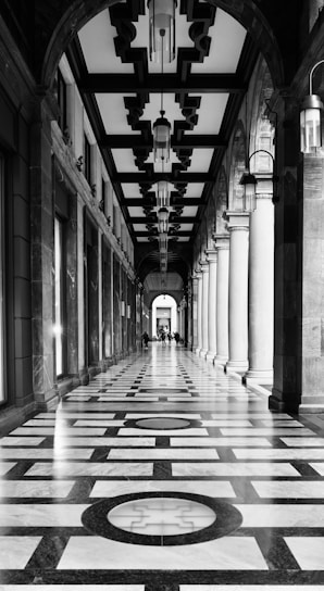 Ornate arched walkway with patterned marble floor