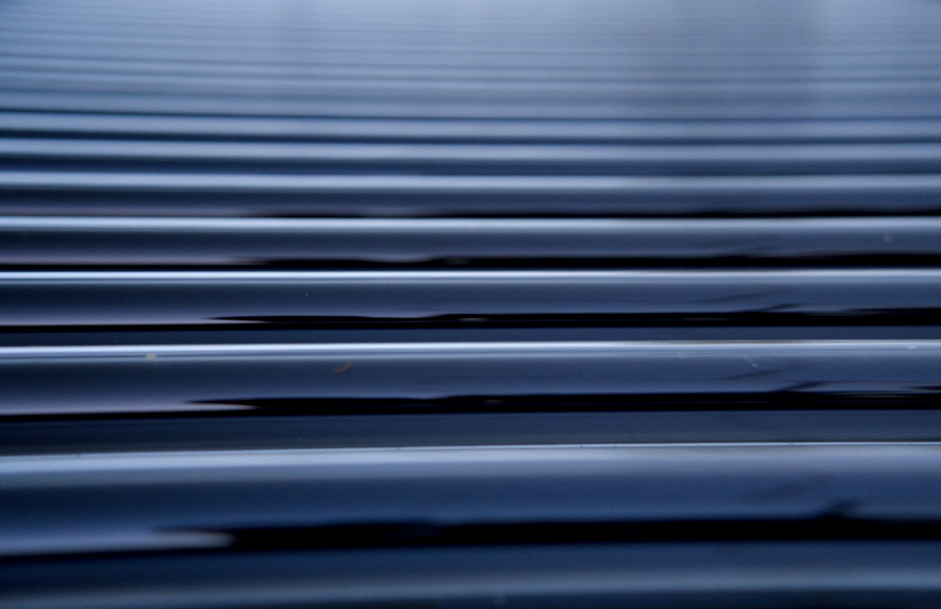 Close-up of horizontal blue metallic corrugated surface