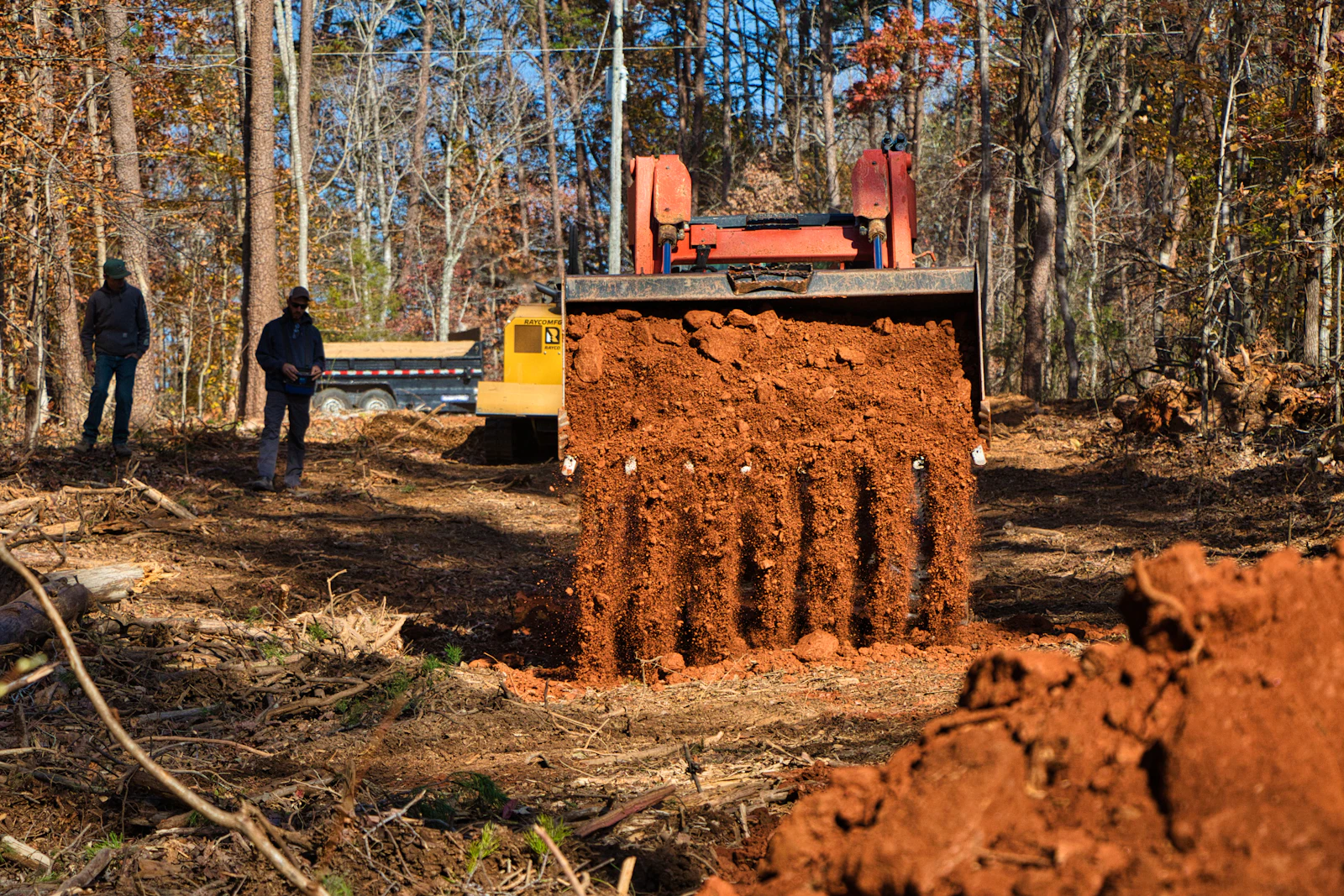 Excavator digging dirt on a work site