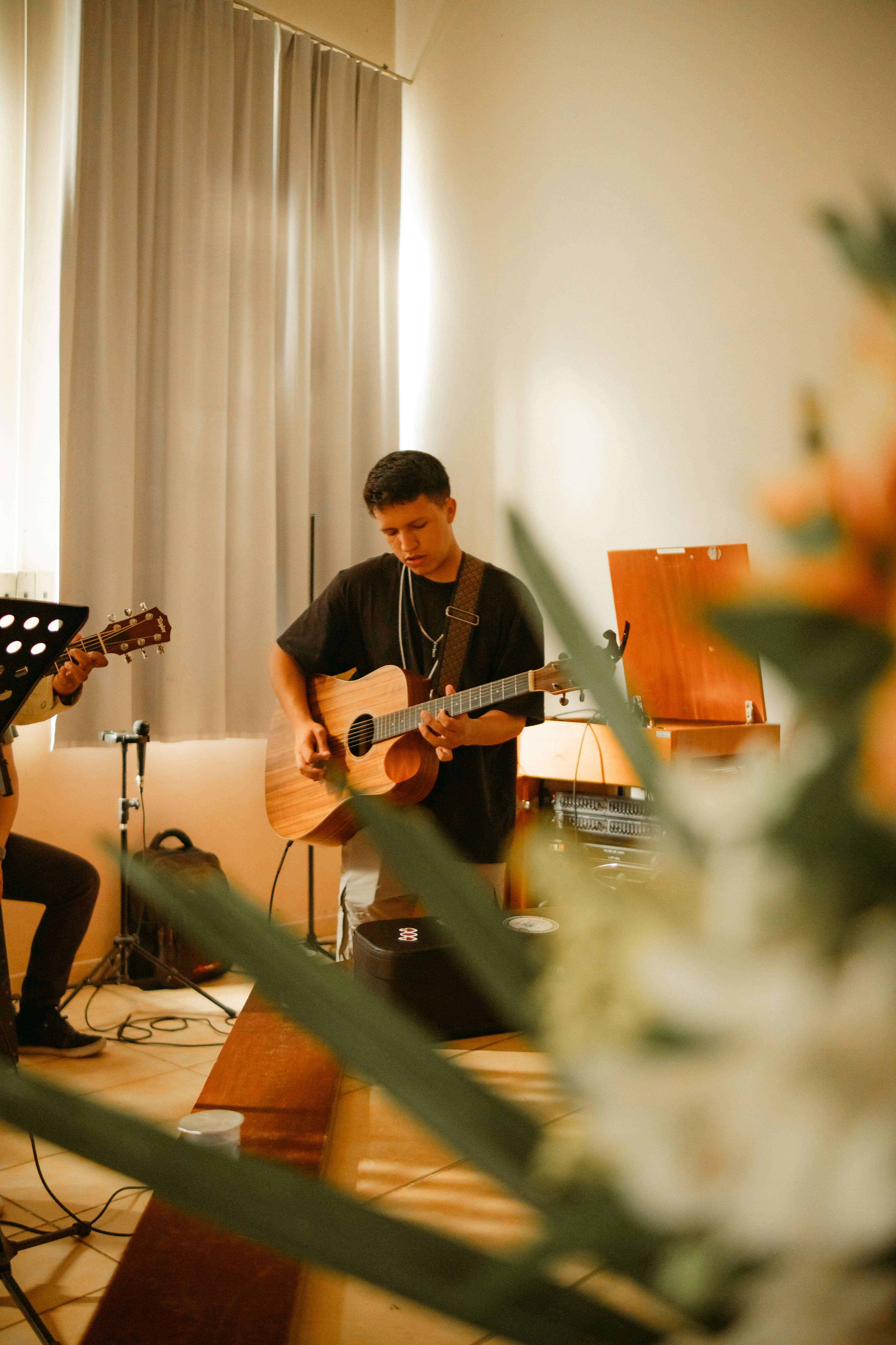 Man playing acoustic guitar on stage