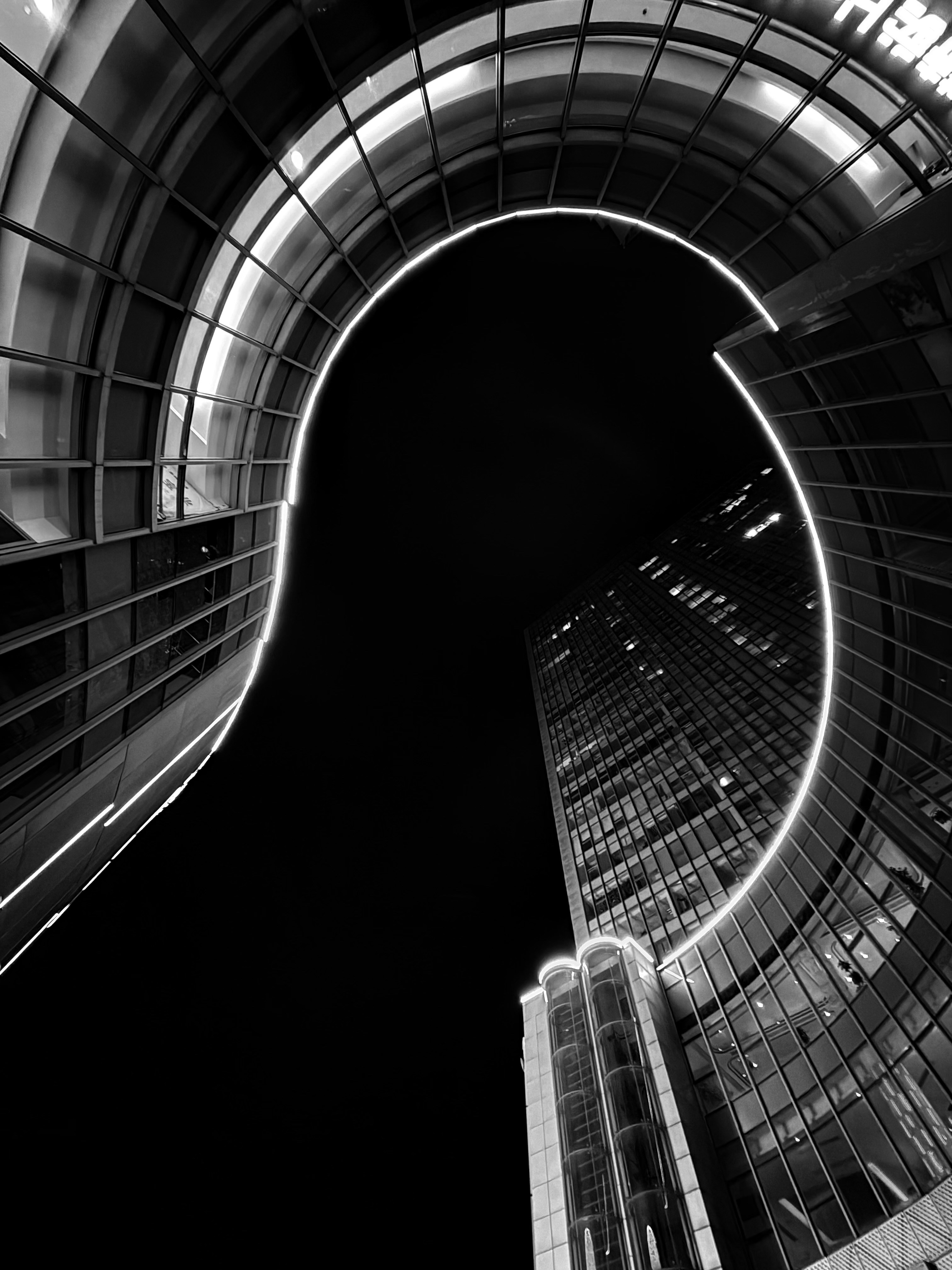 Modern architecture with illuminated curves at night