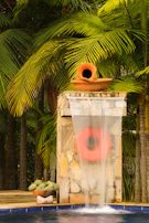 Water feature with terracotta pot and life preserver.