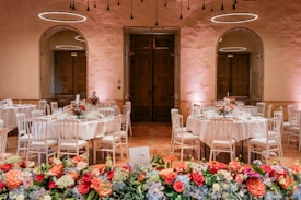 Elegant wedding reception tables with floral decorations