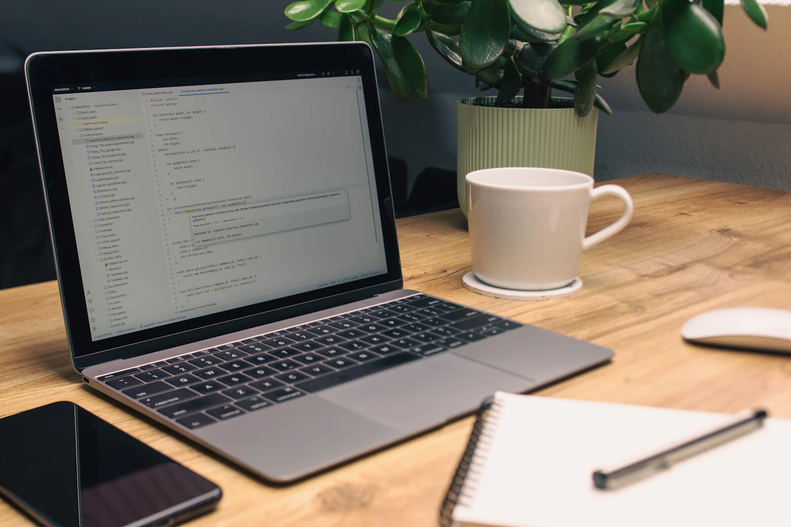 Laptop, notebook and workspace used to compare affiliate programs and organize applications