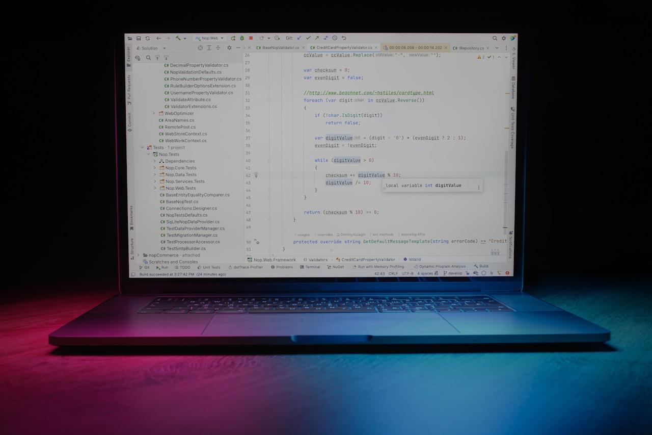 Colorful neon lit laptop screen - code writing and developer experience
