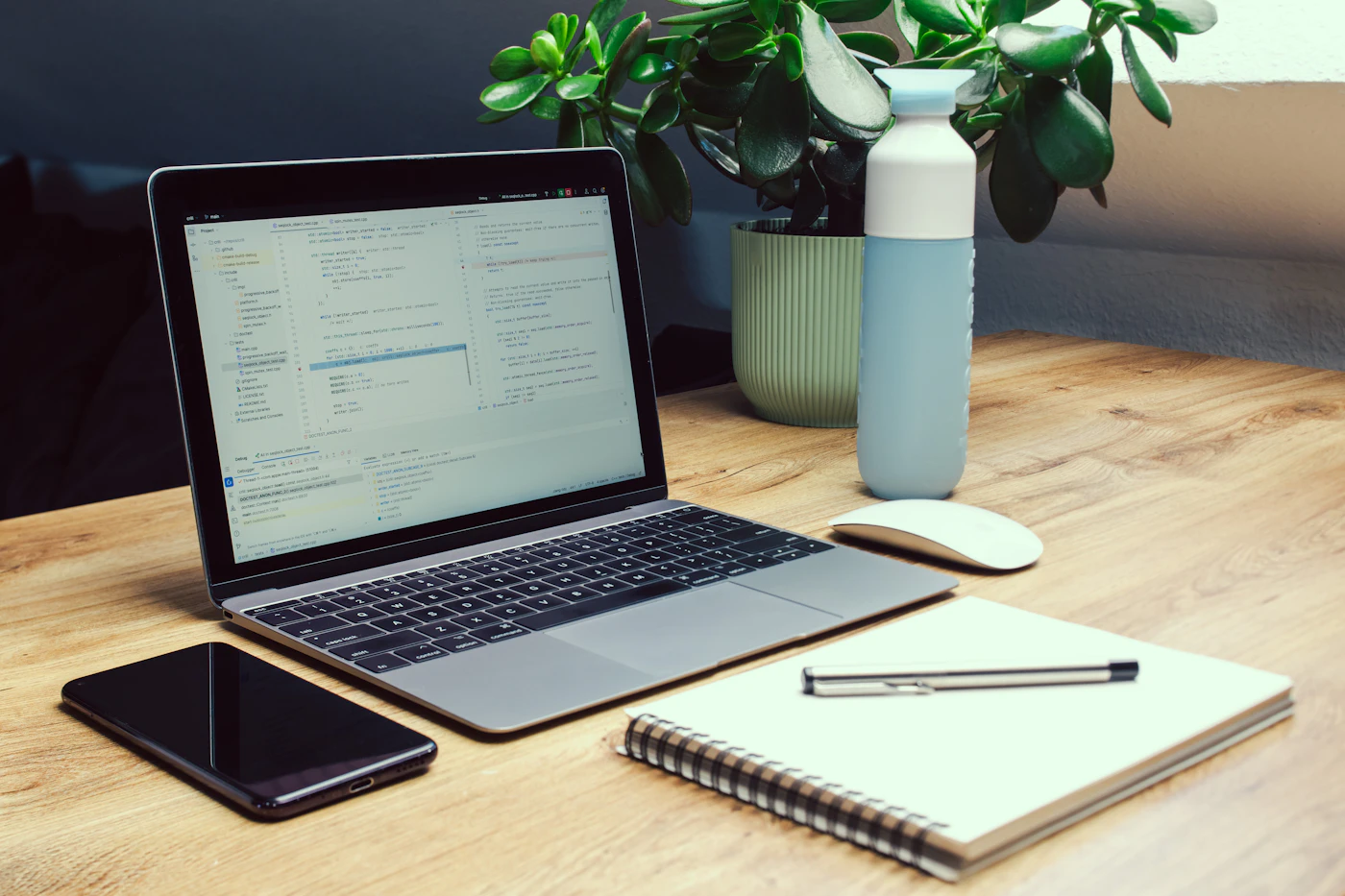 Laptop and notebook on a modern desk