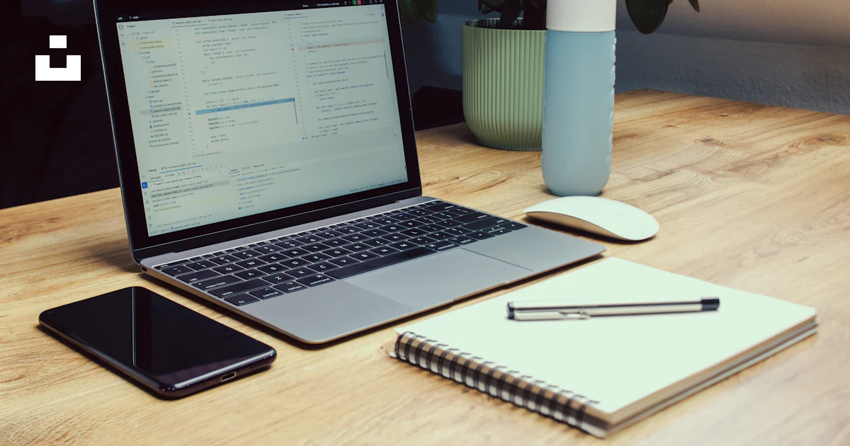 Laptop, phone, notebook, and water bottle on desk. photo – Free ...
