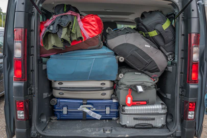 Van packed full with luggage for a trip.
