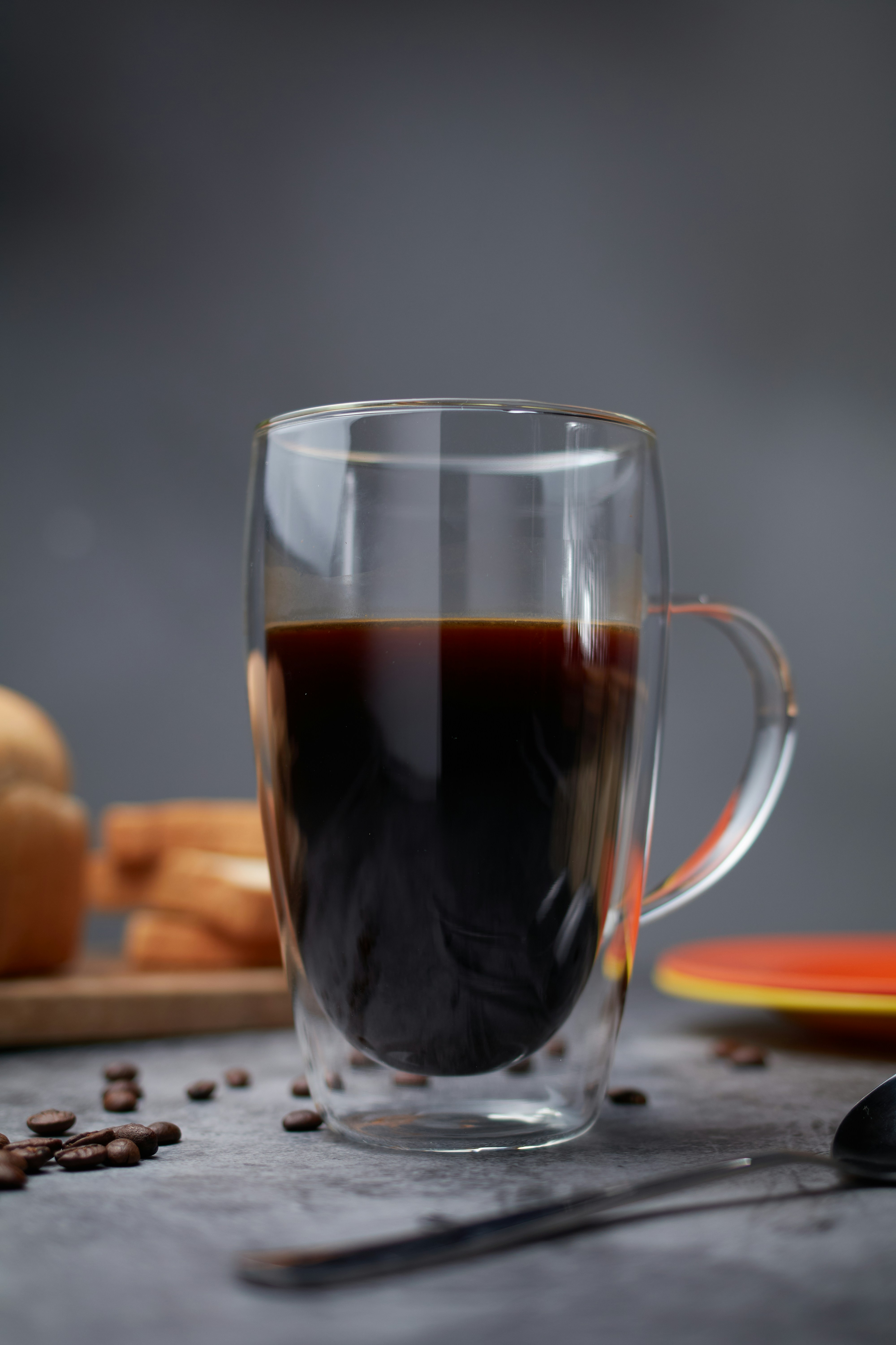 A clear mug filled with dark coffee