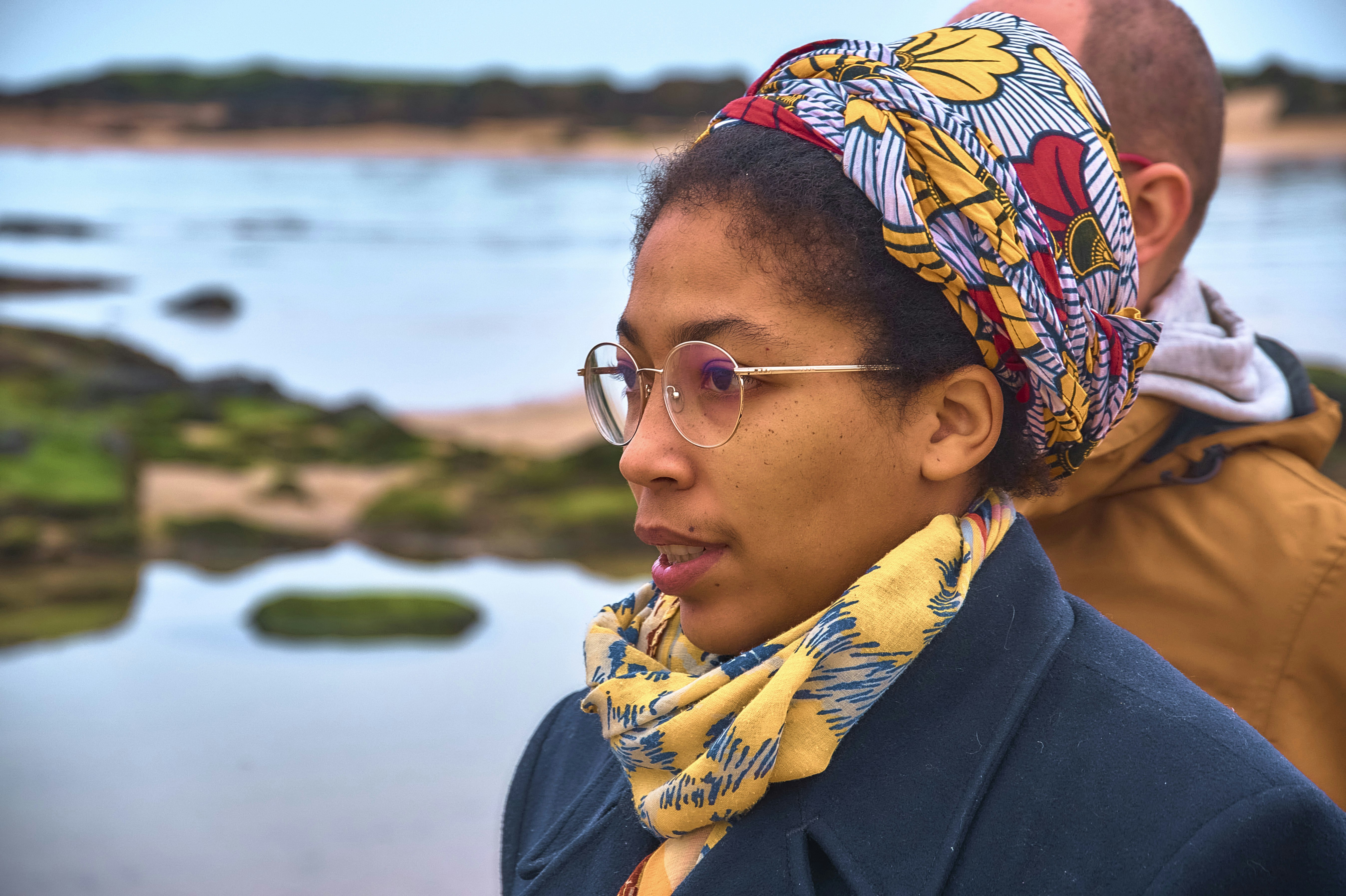 Woman with glasses and headscarf