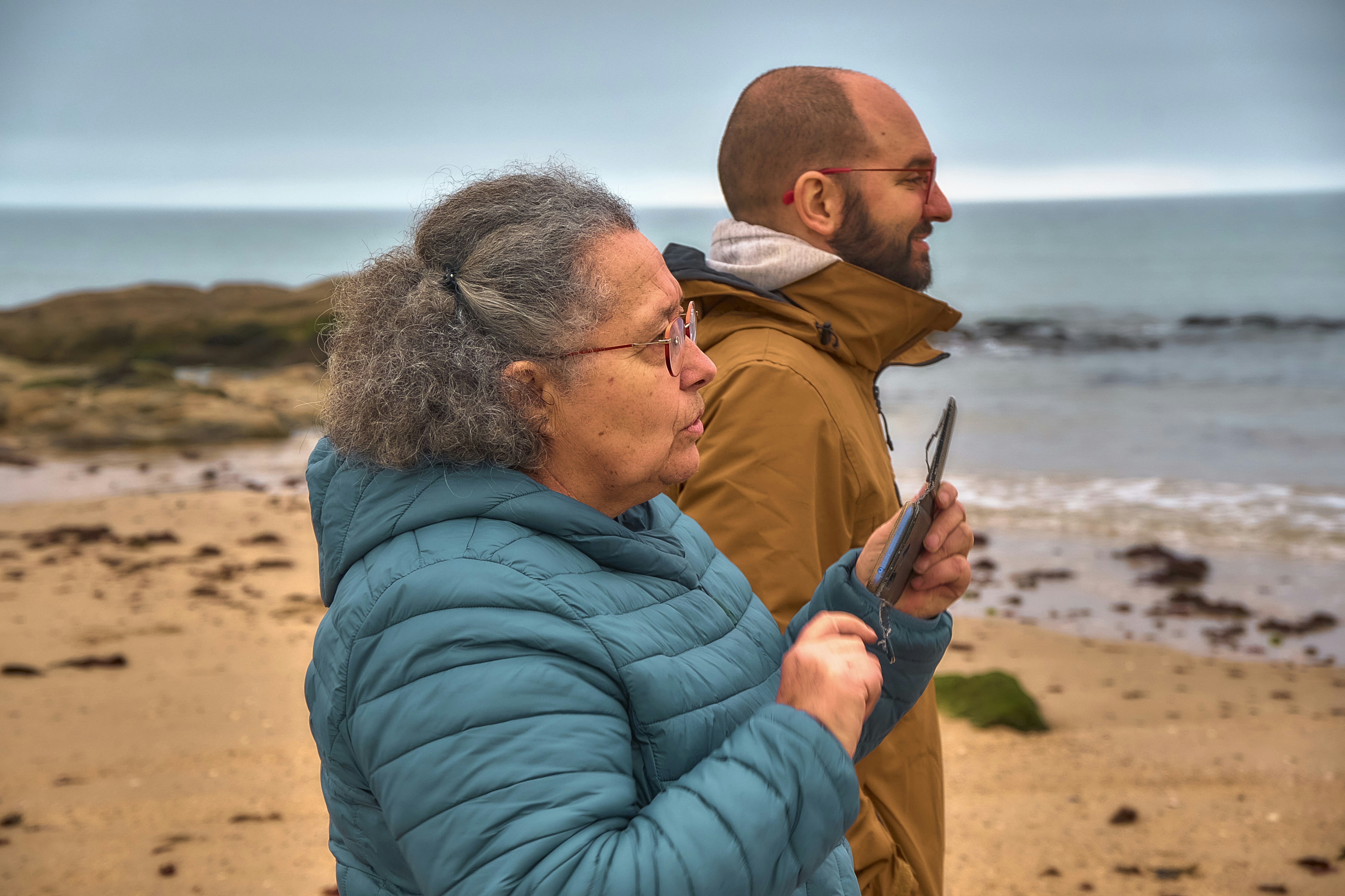 Elderly woman and man on a beach