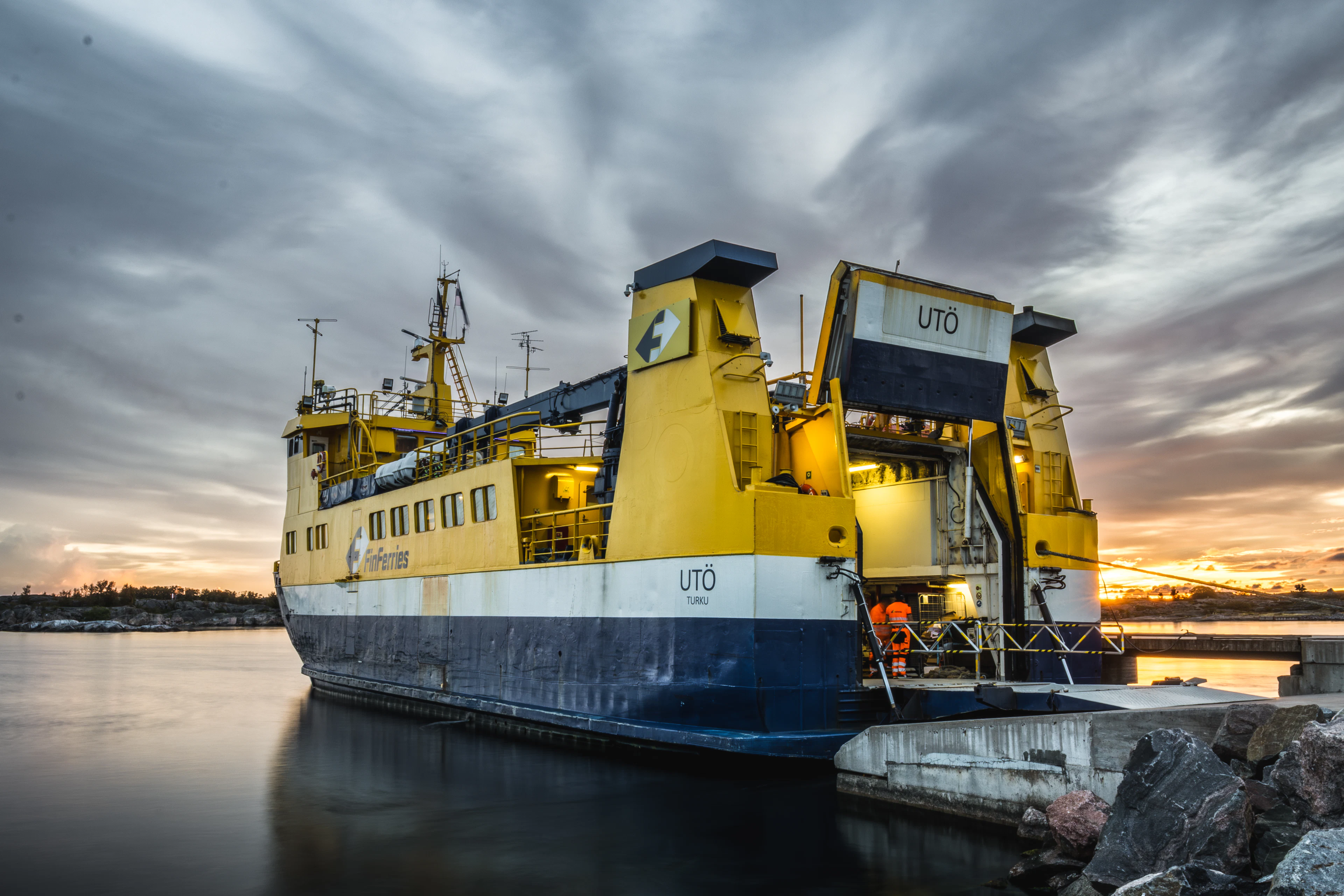 An archipelago ferry at the quay at sunset on the island of Utö