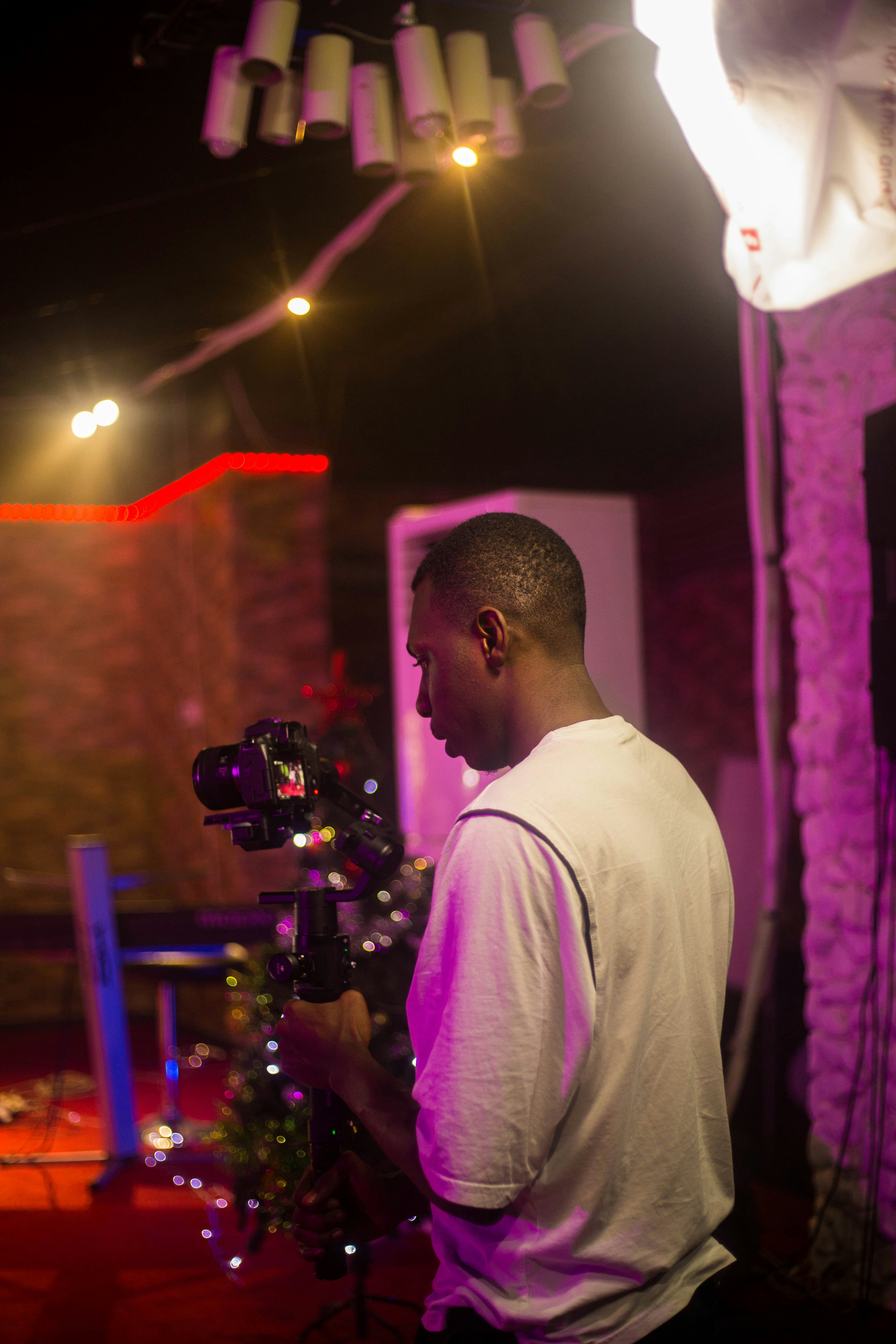 Man filming with professional video camera and stabilizer