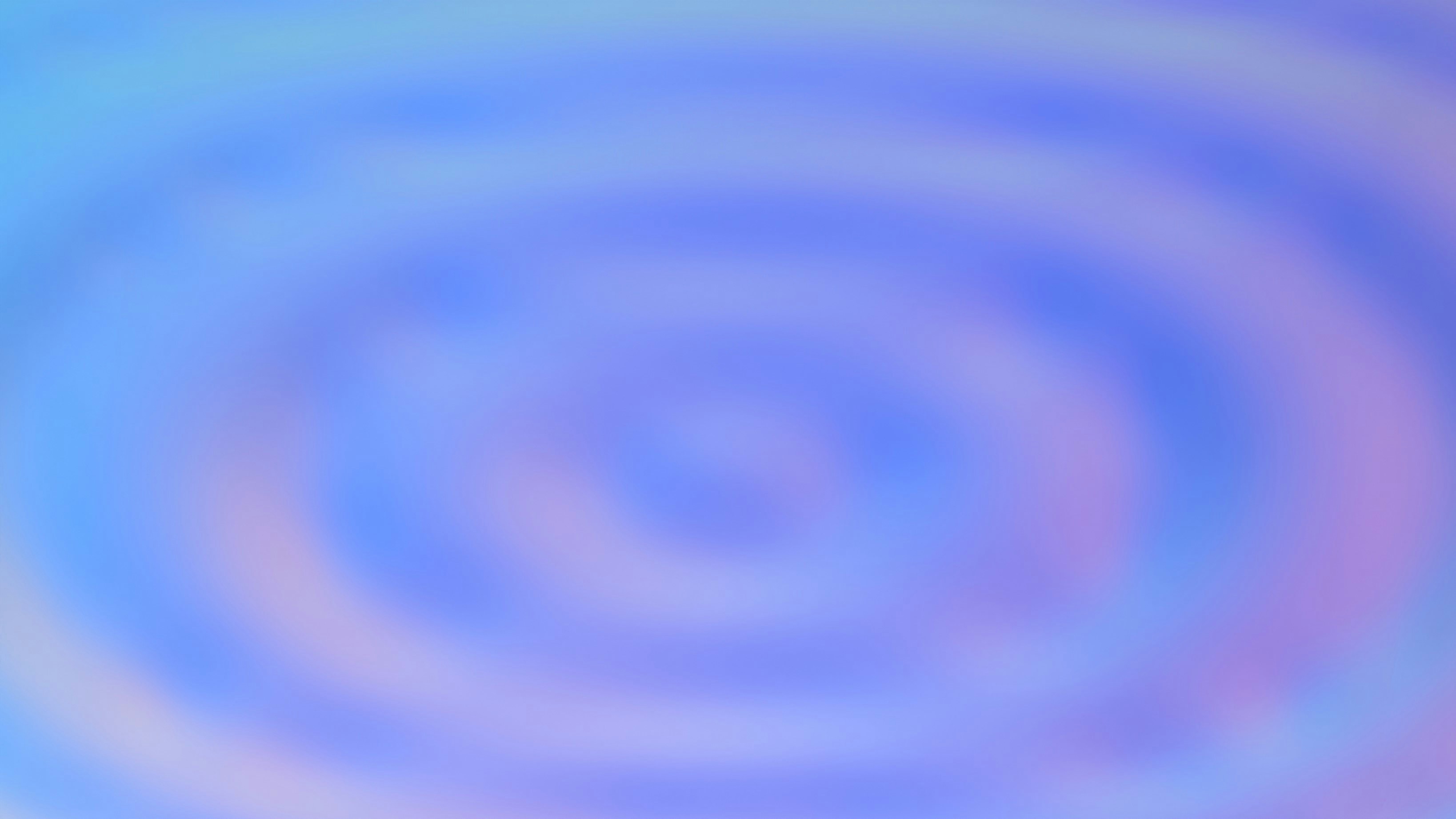 Des cercles concentriques de teintes bleu clair et violet.