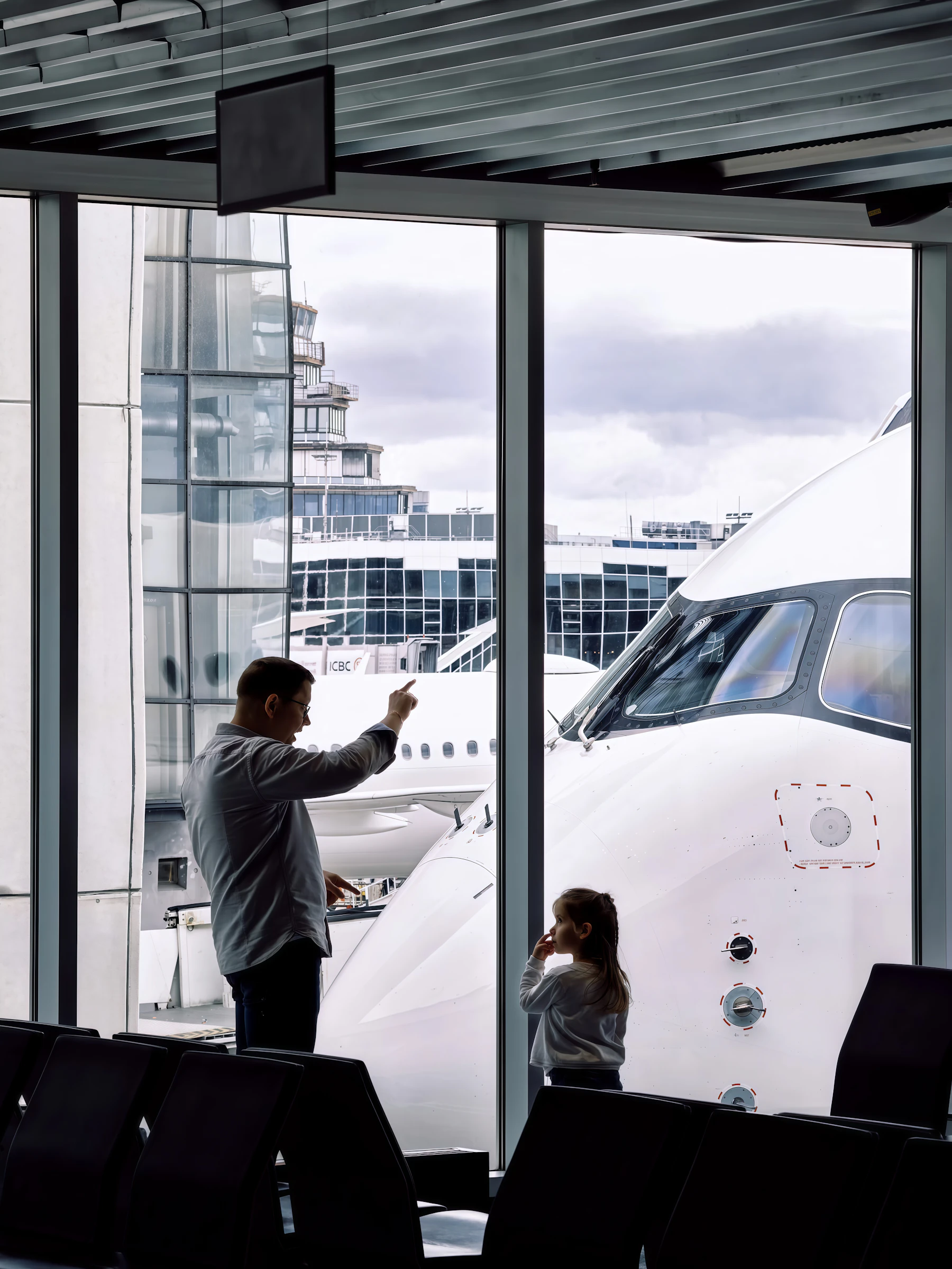 Father and daughter reunited at the airport gate