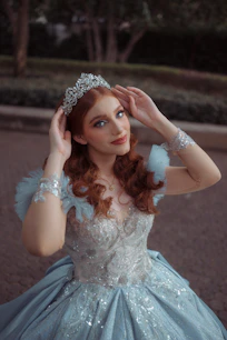 Young woman in a blue princess gown and tiara