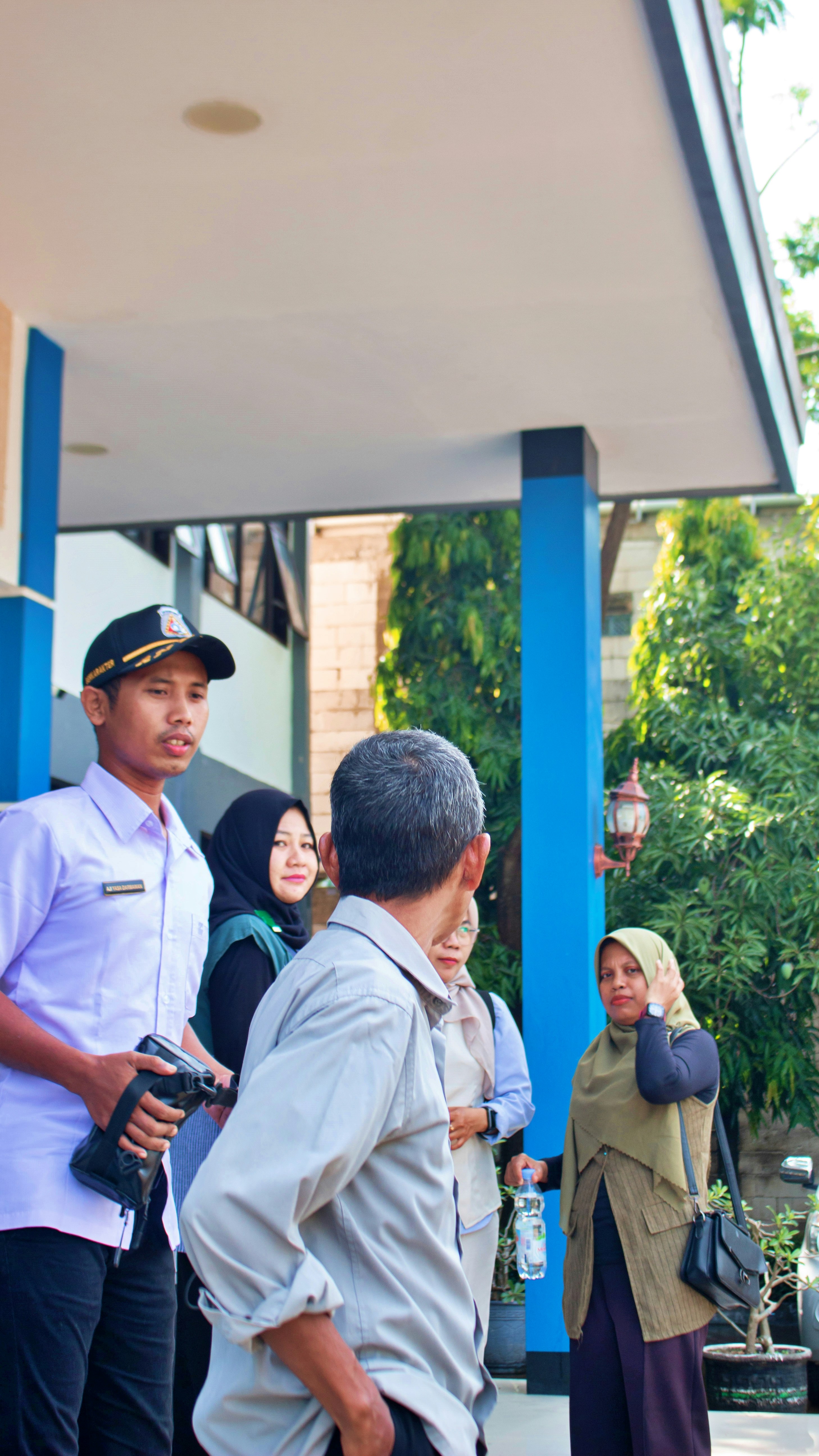 A group of people standing outside a building.