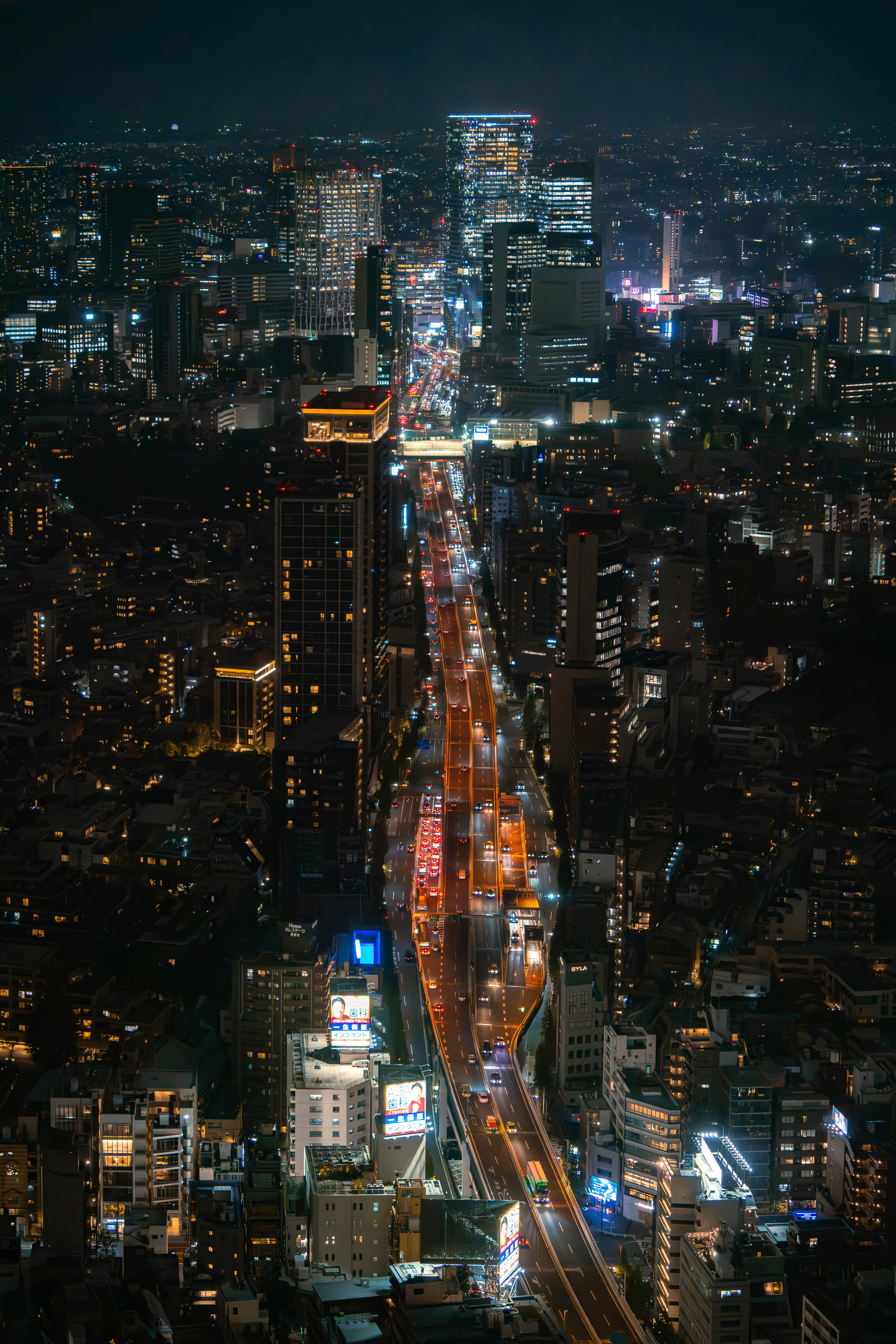 Aerial view of a busy city street at night.