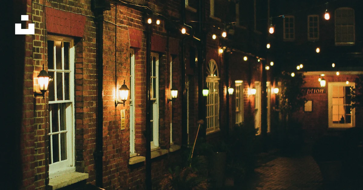Building With String Brick building with string lights at night. photo – Free Night Image on ...