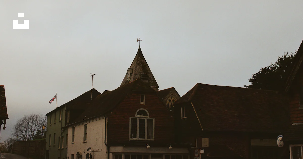 Historic building with a conical roof and weather vane. photo – Free ...