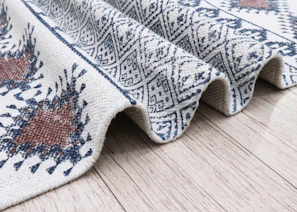 Close-up of a textured rug with geometric patterns Kanha Universal Export