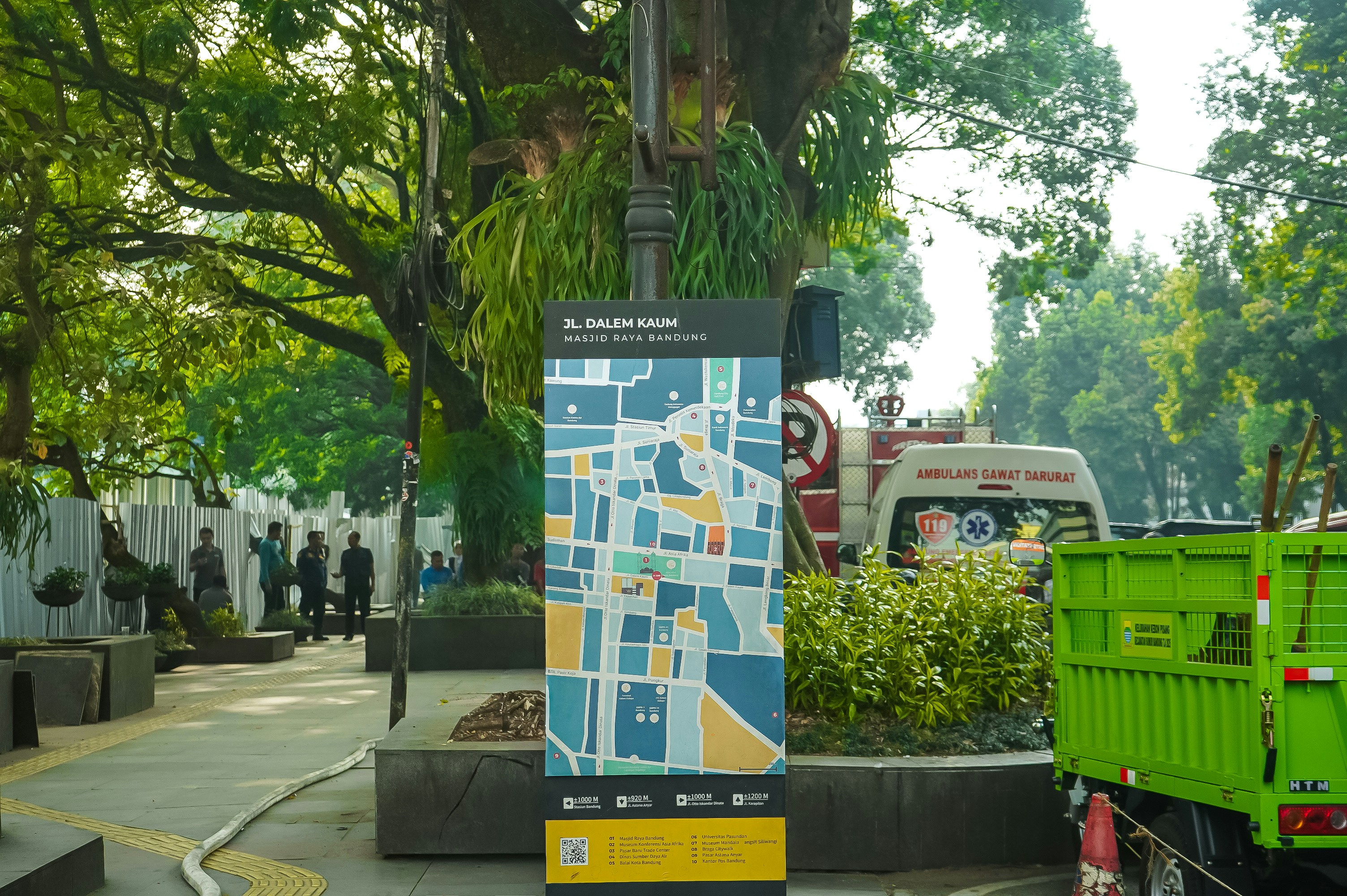 Street map sign with colorful blocks and trees.