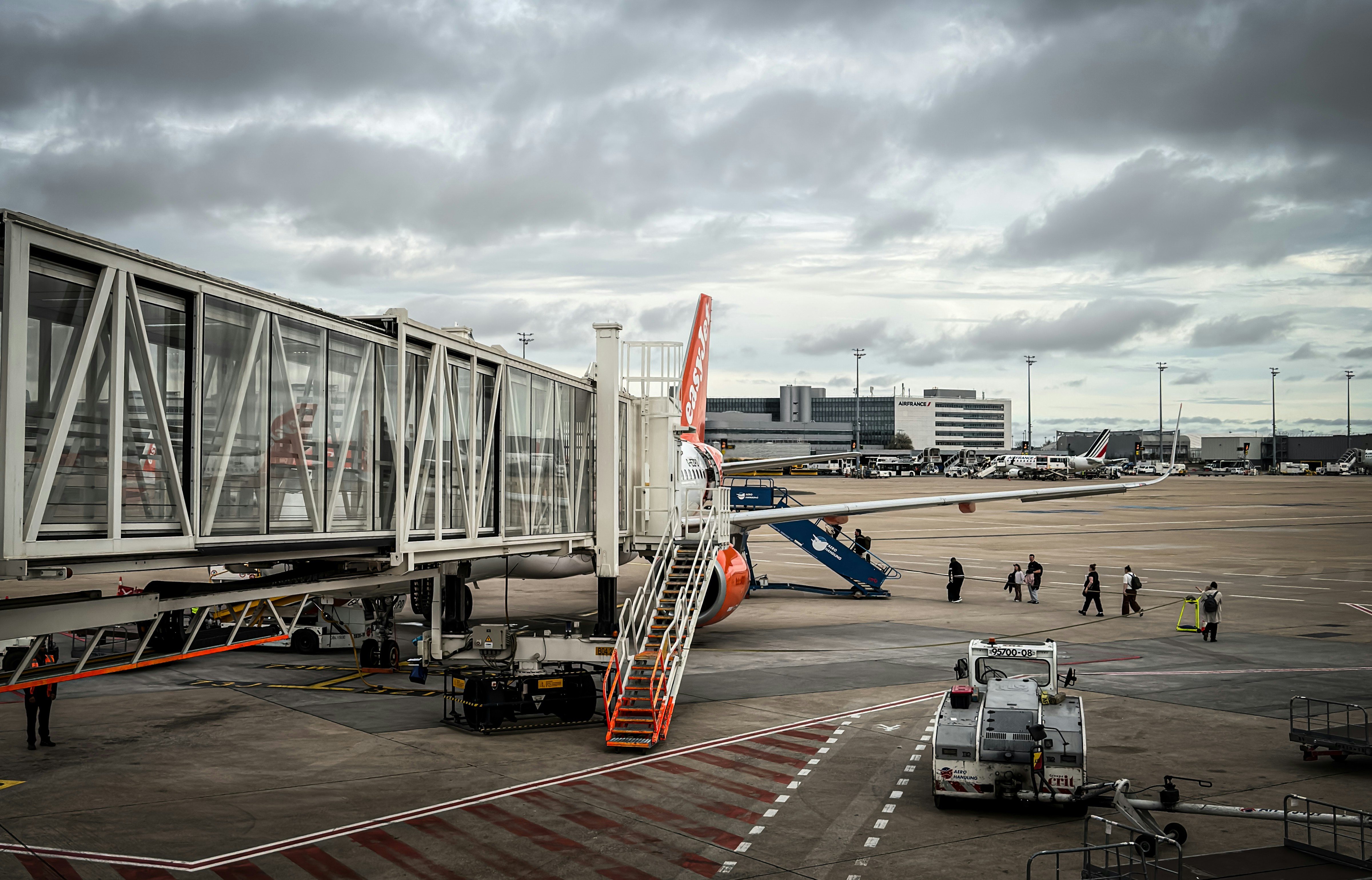 Airplane connected to a jet bridge at airport
