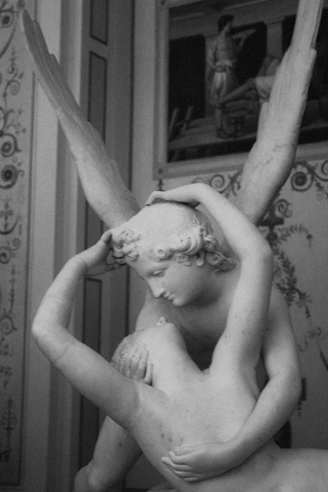 Marble sculpture of two figures embracing