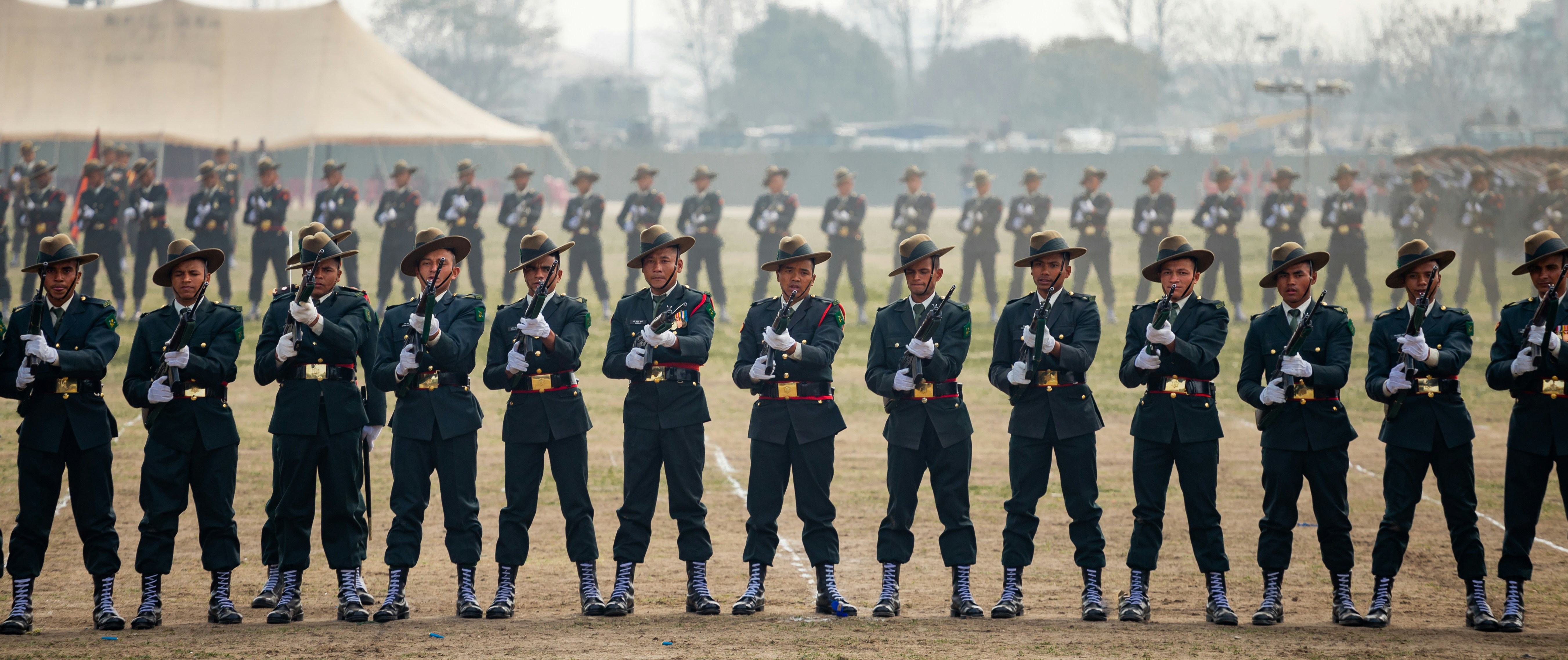 A Sukhoi-30 MKI fighter jet flying high in the sky with an Indian Air Force insignia visible.