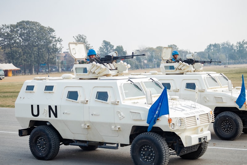 United Nations armoured vehicles with blue-helmeted peacekeeping soldiers