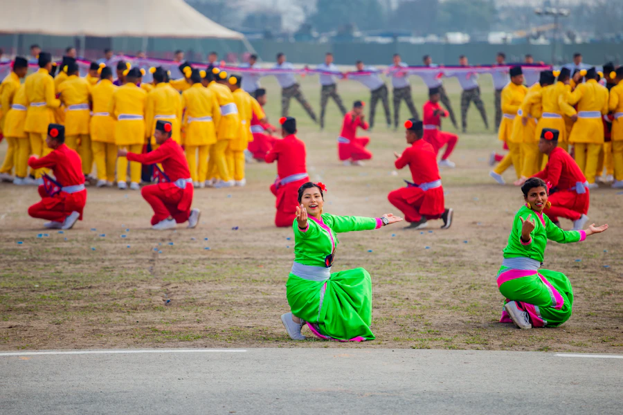 A wushu group performing a synchronised routine in bright costumes