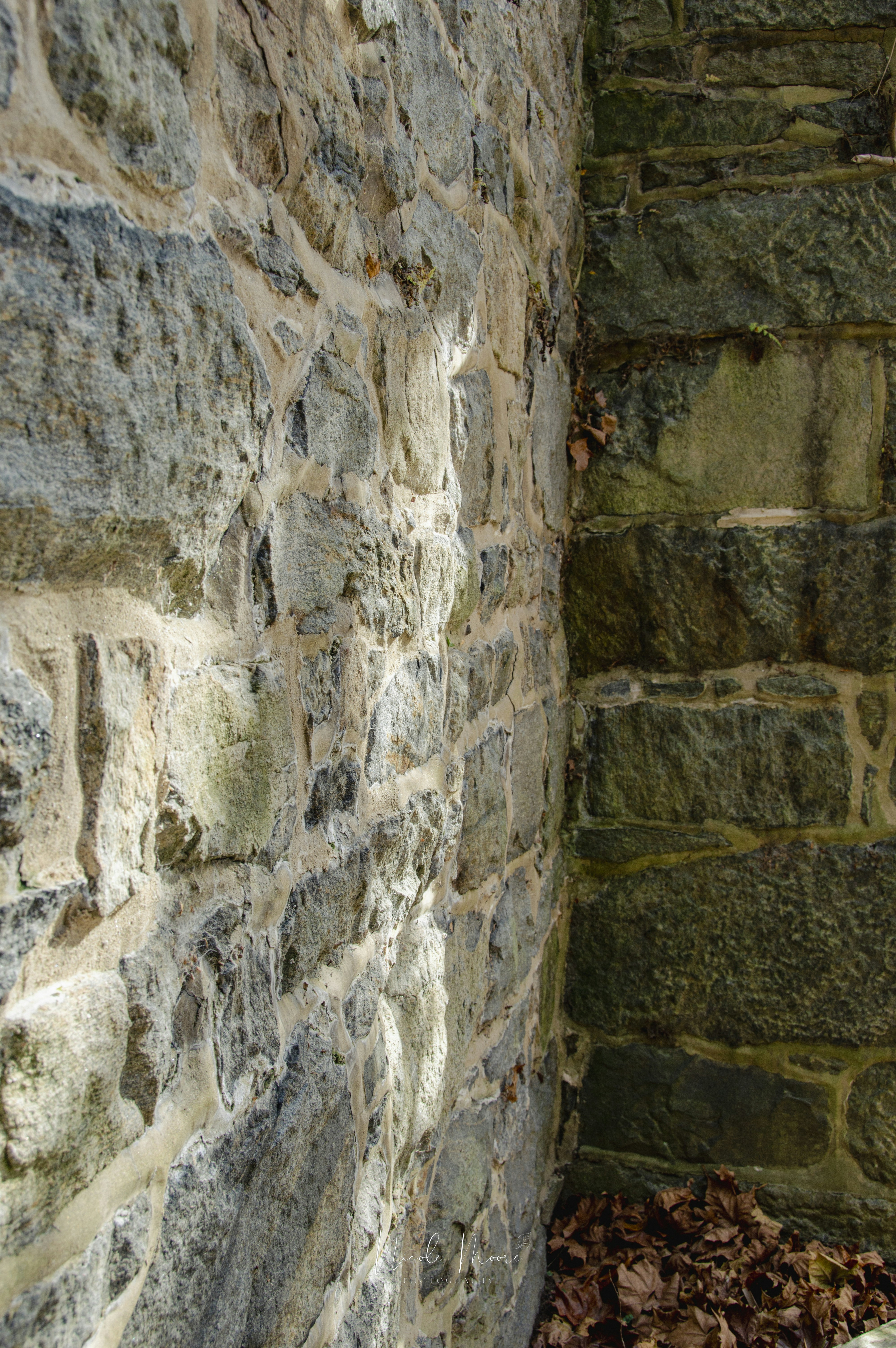 Corner of an old stone building with weathered texture