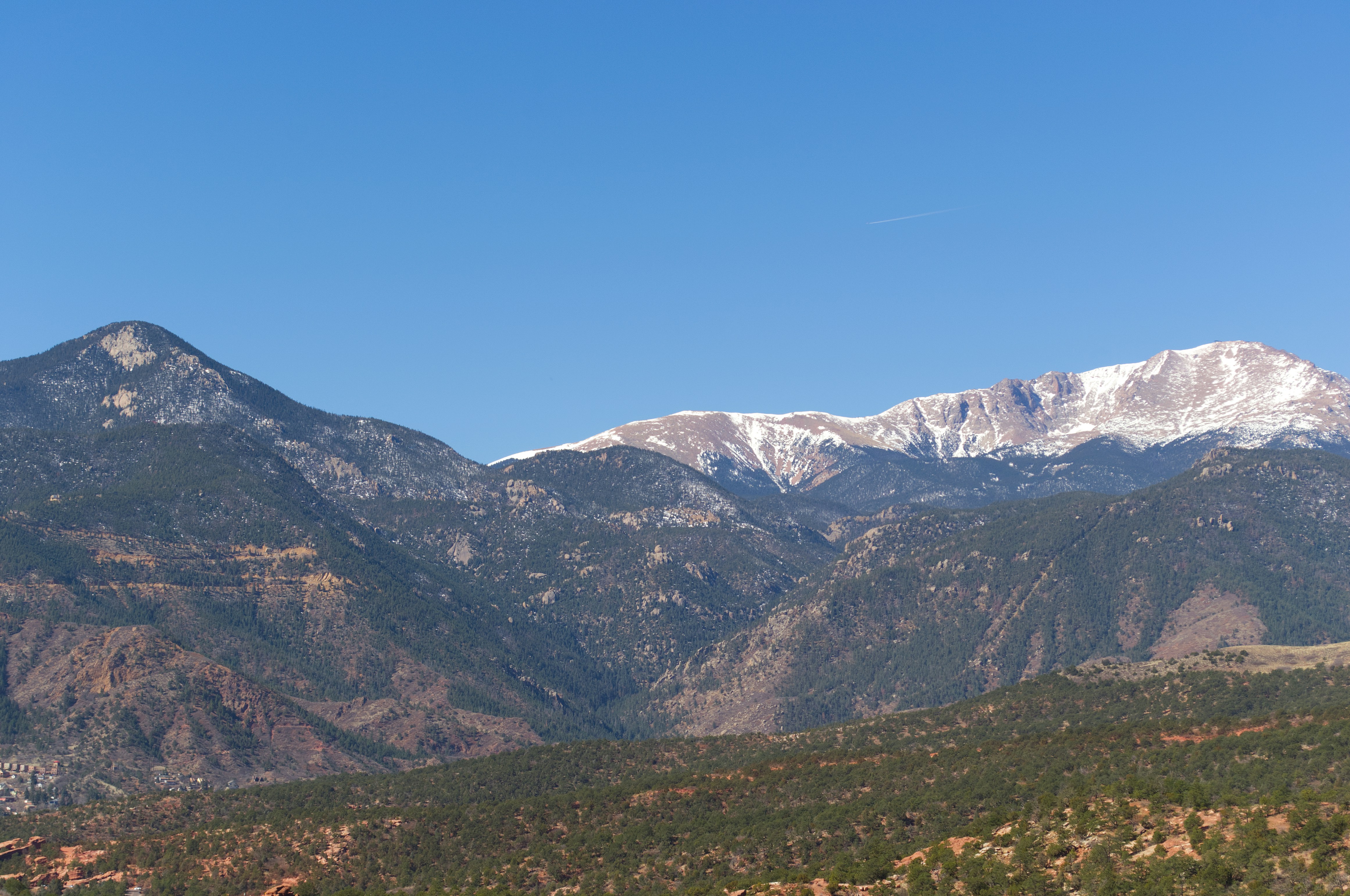 Snow-capped mountains under a clear blue sky.