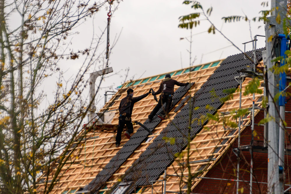 Roofing crew working on a residential roof
