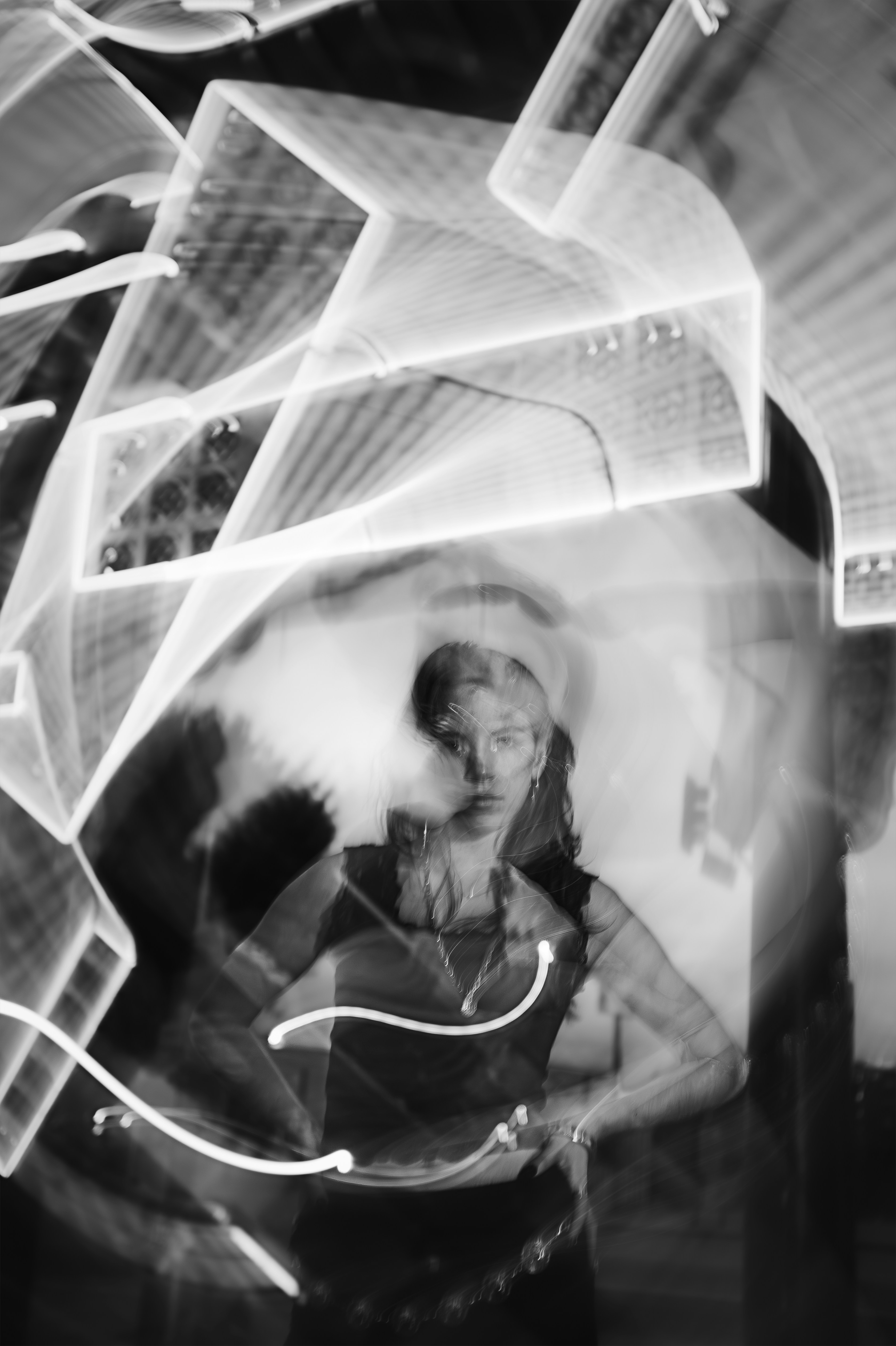 Woman with abstract light trails around her