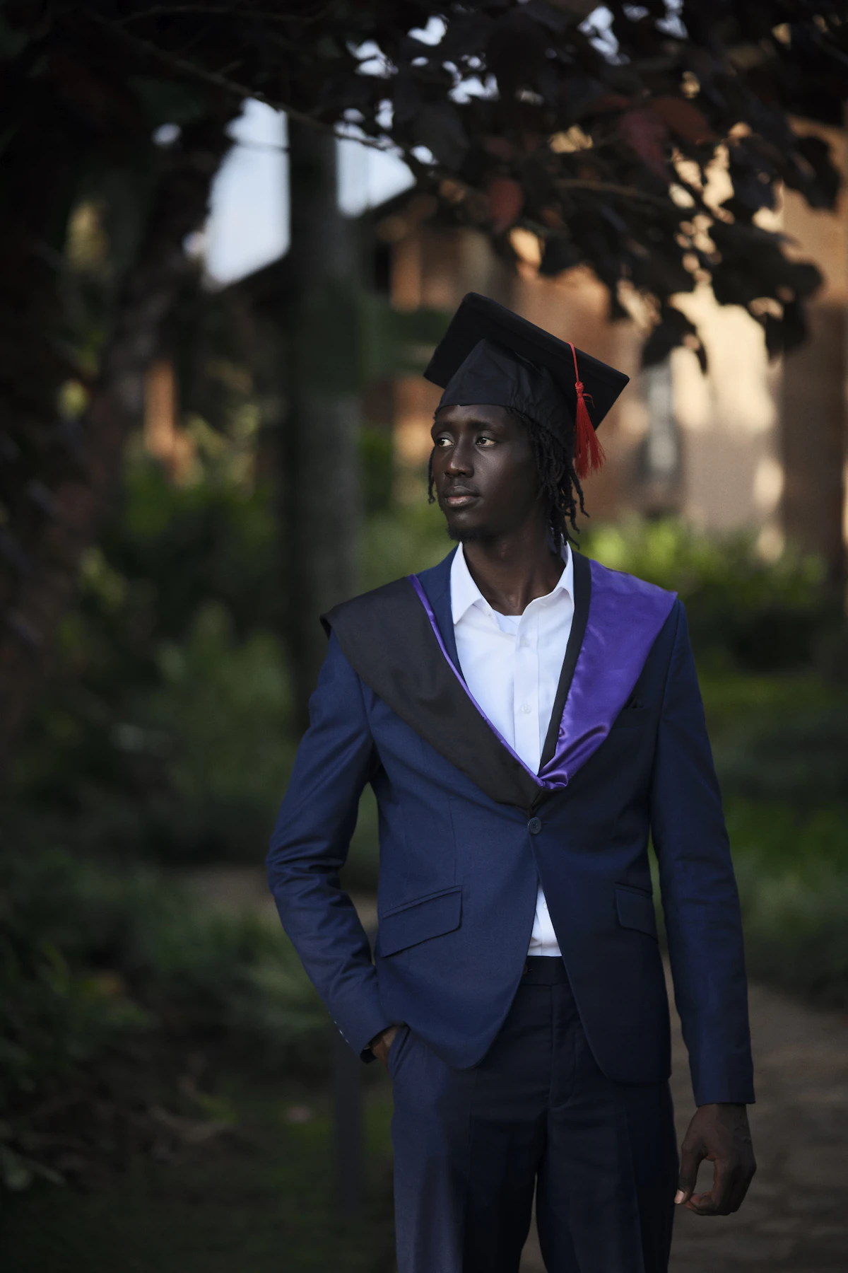 Sample image: A graduate in cap and gown standing outdoors