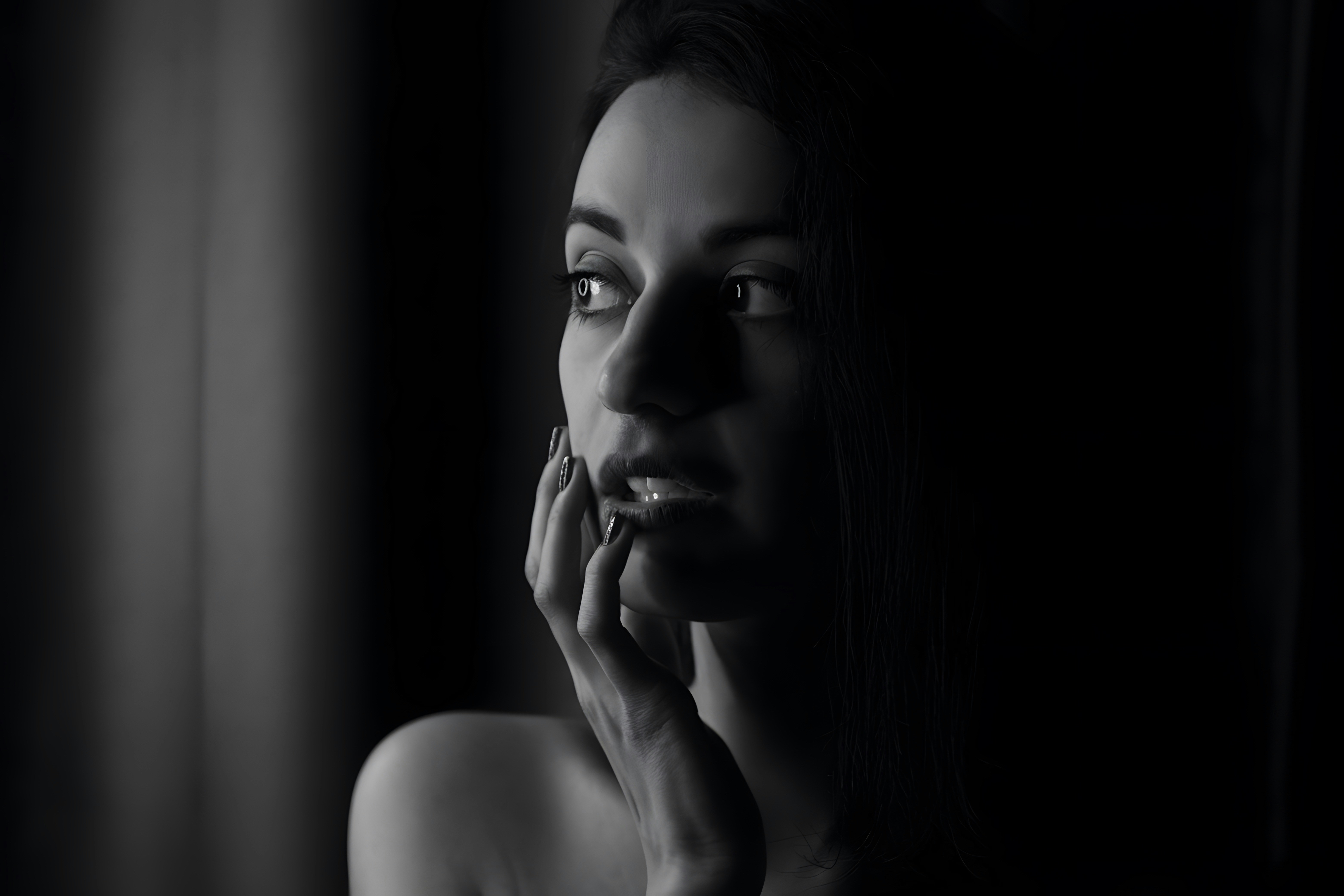 A woman with her hand on her face